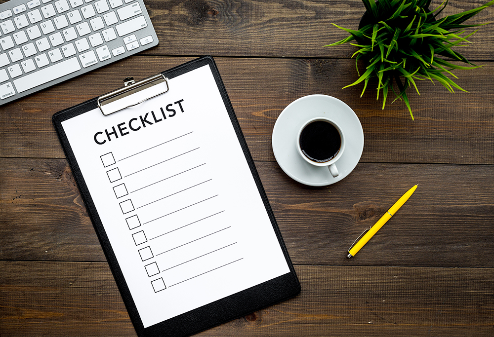 Blank checklist with space for ticks on pad on office desk. Checklist for office worker, manager, businessman, chief on dark wooden background top view